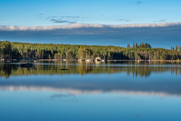 Summer view of the shore of a small lake in Sweden