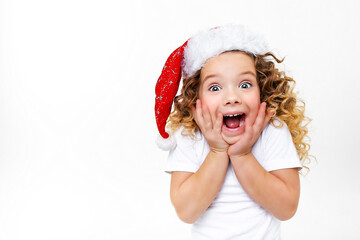 excited curly child in santa hat white background