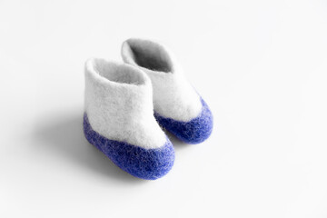 Felt boots on a White background. Finland Independence Day. Card. Copy space.