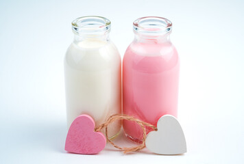 Hearts and two bottles of milk drink. Concept of drinks, holiday backgrounds.