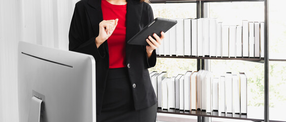 A businesswoman using the touchpad to team meeting