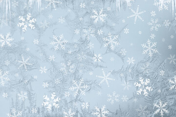 Obraz premium Ice flowers or frost work. Christmas graphic pattern. Light blue background. toped with al lot of different size and shapes of ice flowers
