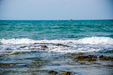 Ocean waves breaking on the rocks on the shore. - 391542632