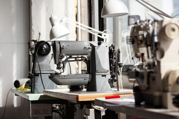 Old sewing machine. Tailor workplace. 