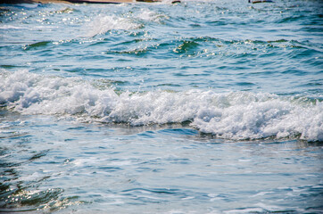 Ocean waves breaking on the rocks on the shore. - 391543883