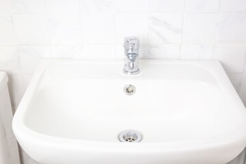 Bathroom faucets are used to wash their hands.