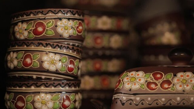 Chamomiles, wooden beads and decorative textile belt of white embroidered fabric