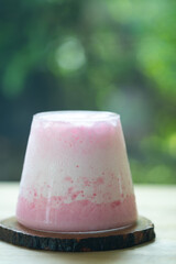 Thai style pink milkshake in glass for summer so delicious