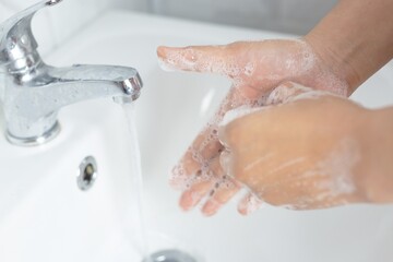 Bathroom faucets are used to wash their hands.