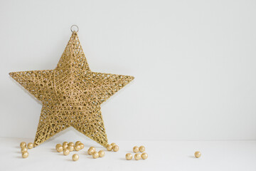 Fototapeta na wymiar Golden Christmas star and small balls 