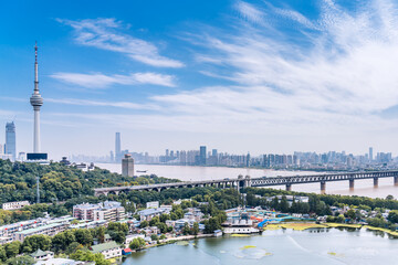 Obraz premium Sunny day scenery of Guishan TV Tower and Yangtze River Bridge in Wuhan, Hubei Province, China