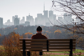 Young man looking to downtown Toronto