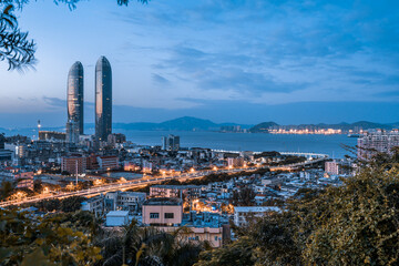 High angle night view of twin towers and Viaduct in Xiamen, Fujian, China