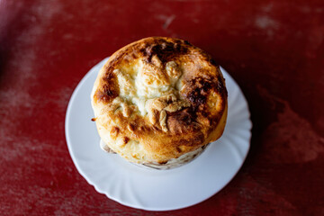 A pot of stew covered with a tortilla.
