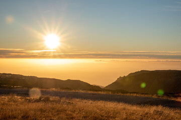 Sunset on the mountain with a ray of sun