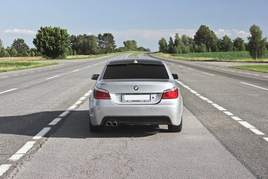 Chernihiv, Ukraine -  July 6, 2018: BMW E60 on the road against the sky