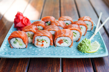 Philadelphia roll sushi with salmon, prawn, avocado, cream cheese. Sushi menu. Japanese food.