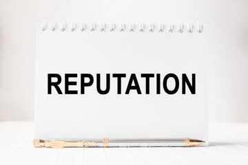 text REPUTATION in a magnifying glass, office concept, business concept, Finance