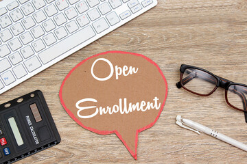 OPEN ENROLLMENT text written on speech bubble cardboard