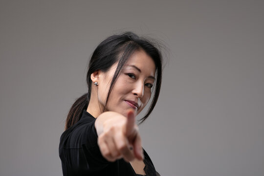 Woman pointing in blame or identification