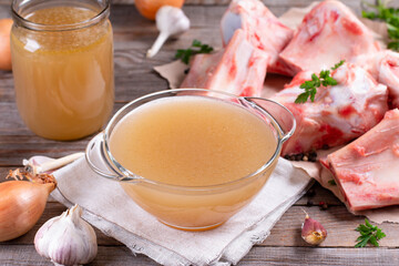 Bone broth soup made from beef in the glass dish, natural source of collagen