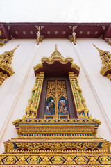 Fototapeta premium The beautiful of thai style windows. External view of the church in temple.
