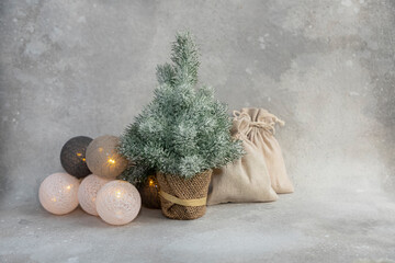 Christmas or New Year composition. Christmas tree, candle, garland, gifts. Place for text.