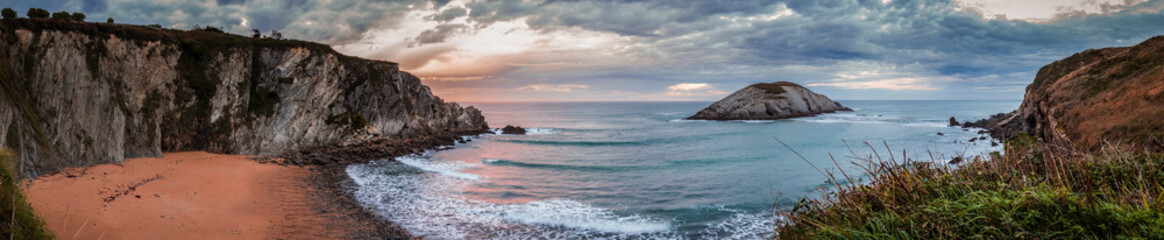 Panoramic landscape at sunset in Covachos Beach, Cantabria.