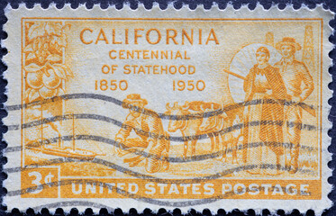 a postage stamp printed in the US showing the gold miners who fueled California’s rapid growth, as well as other important resources like oil and citrus fruit.Text: California Statehood Centennial