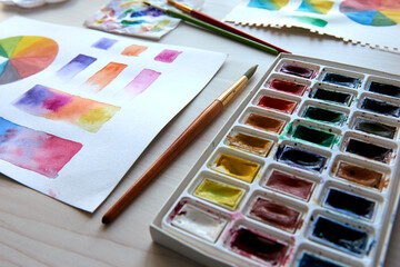 Artist's workplace. Art supplies brushes, paints, watercolors. Art studio. Drawing lessons....