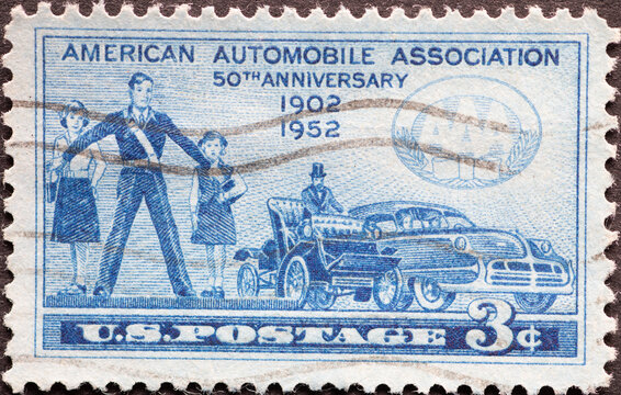 USA - Circa 1952 : a postage stamp printed in the US showing a crossing guard protecting two young girls from stepping into the road an historic cars. Text: American Automobile Association