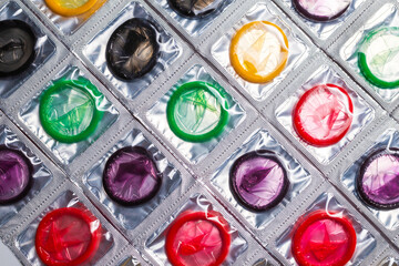 Colorful condoms background.