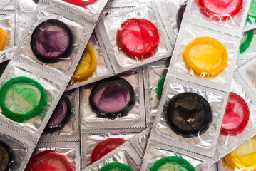Colorful condoms background.