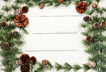Fototapeta premium Happy New Year 2020 greeting card. Christmas branches on rustic wooden background. Space for text. Top view