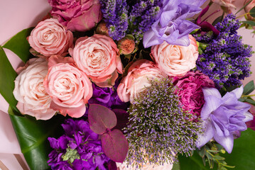 Bouquet of  soft pink flowers in wrapping paper.
