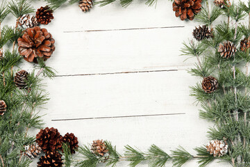 Obraz na płótnie Canvas Happy New Year 2020 greeting card. Christmas branches on rustic wooden background. Space for text. Top view