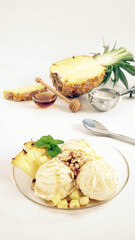 pineapple ice cream topping with honey and almond crushed
