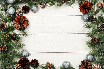 Fototapeta na wymiar Happy New Year 2020 greeting card. Christmas branches on rustic wooden background. Space for text. Top view
