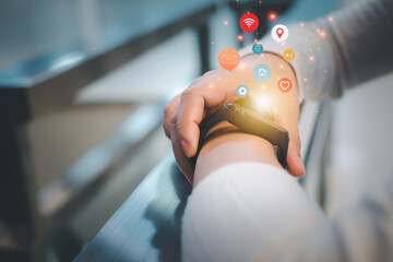 Woman is setting up a smart watch for use innovative technology. Mixed media, digital..