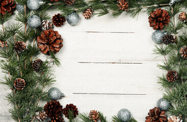 Obraz na płótnie Canvas Happy New Year 2020 greeting card. Christmas branches on rustic wooden background. Space for text. Top view