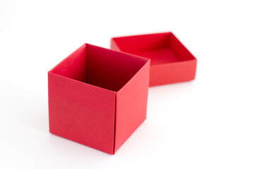 Opened red gift box isolated on white background. Christmas and New Year. Festive congratulations.