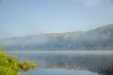 Fototapeta premium Thick fog on the river Bank