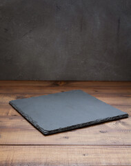 slate stone tray at wooden table