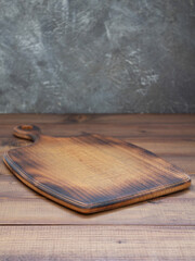 cutting board at wooden table