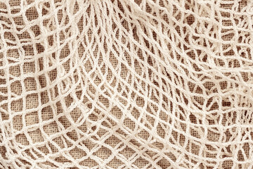 Texture of mesh string bag, recycling, top view. Recycling, ecology, zero waste concept
