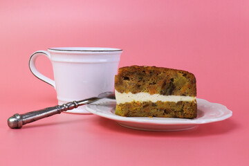 Close up Carrot Cake with Hot Latte , Pink Background