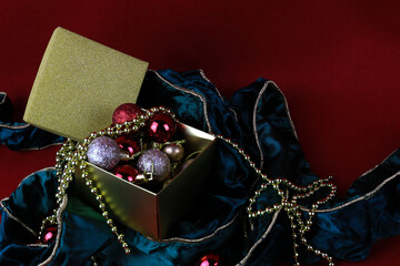 Christmas Ornaments in a Gold Box, Red Background