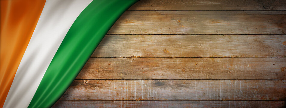 Ivorian flag on vintage wood wall banner