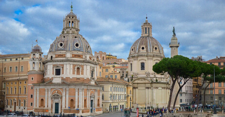 Fototapeta na wymiar Trajan Column, Catholic churches and pine trees at Piazza Venezia, Rome, Italy