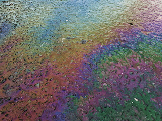 Fototapeta na wymiar Image of color Gasoline fuel spots on Asphalt Road Background. Ground pollution concept image